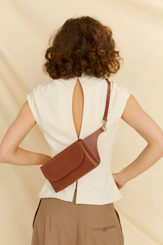 Model faced backward wearing the Effie leather belt bag across the back