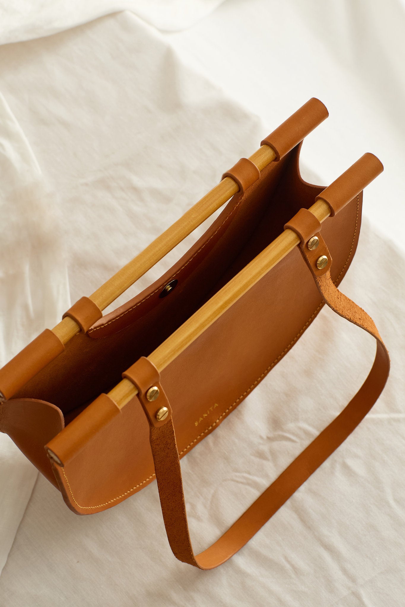 Aerial view of the Celine leather shoulder bag in tan showing the raw interior