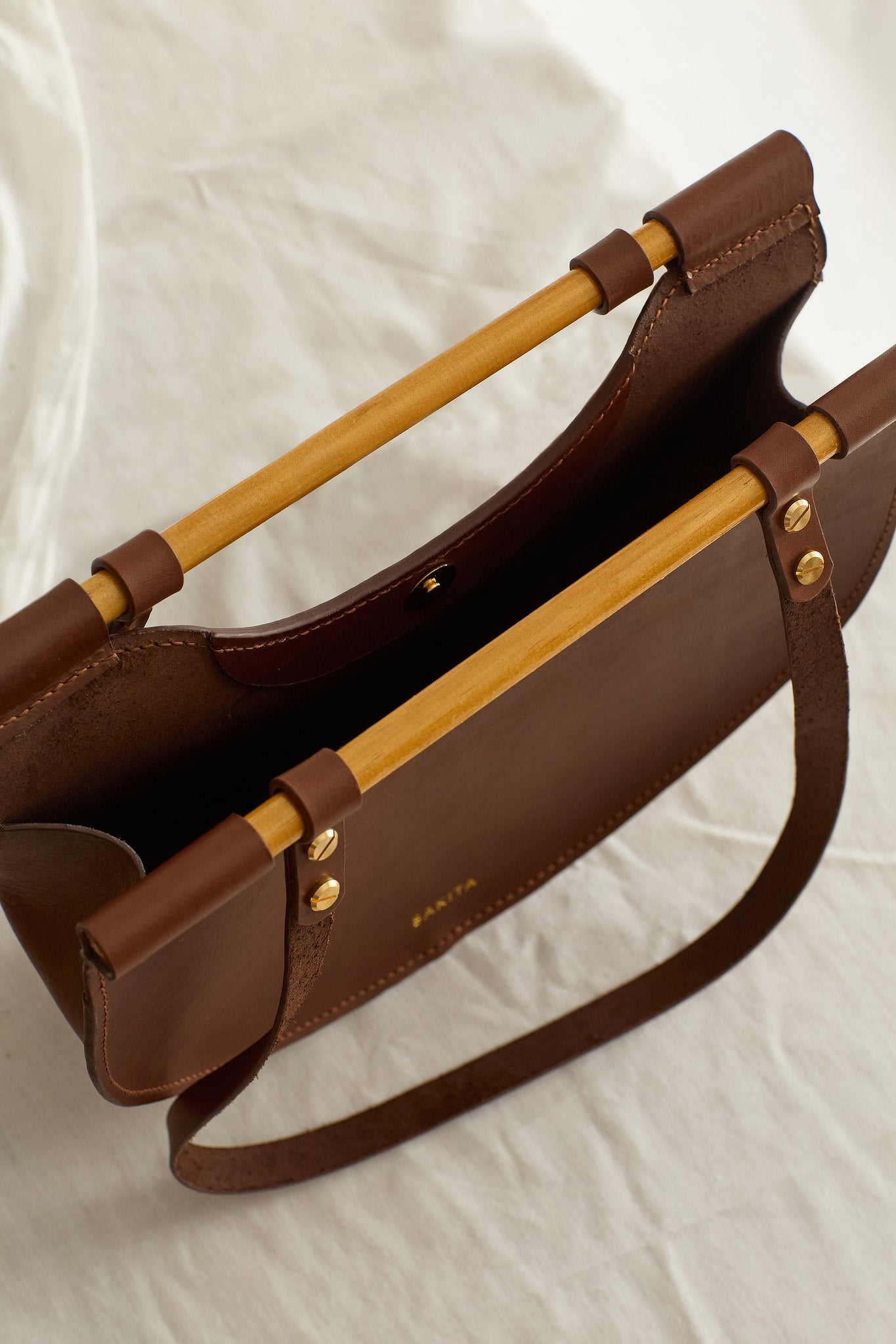 Aerial view of the Celine leather shoulder bag in brown showing the unlined interior