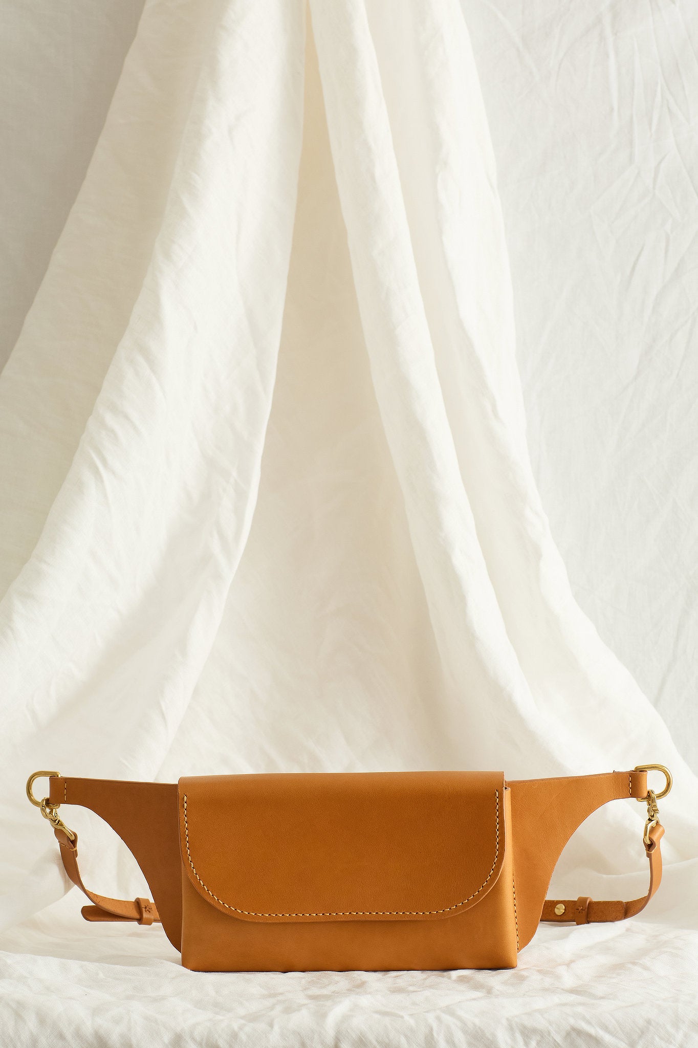 Front view of the Effie leather belt bag in tan