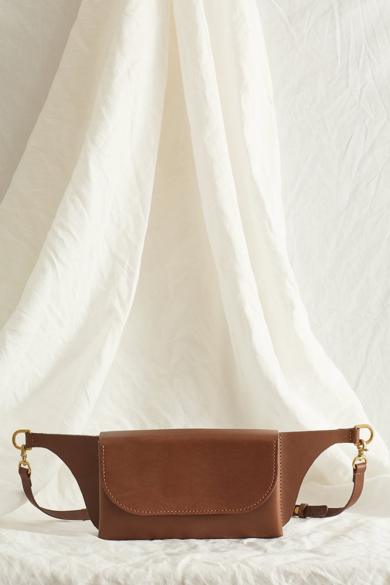 Front view of the Effie leather belt bag in brown