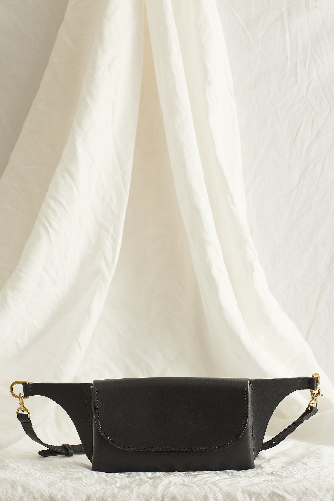 Front view of the Effie leather belt bag in black