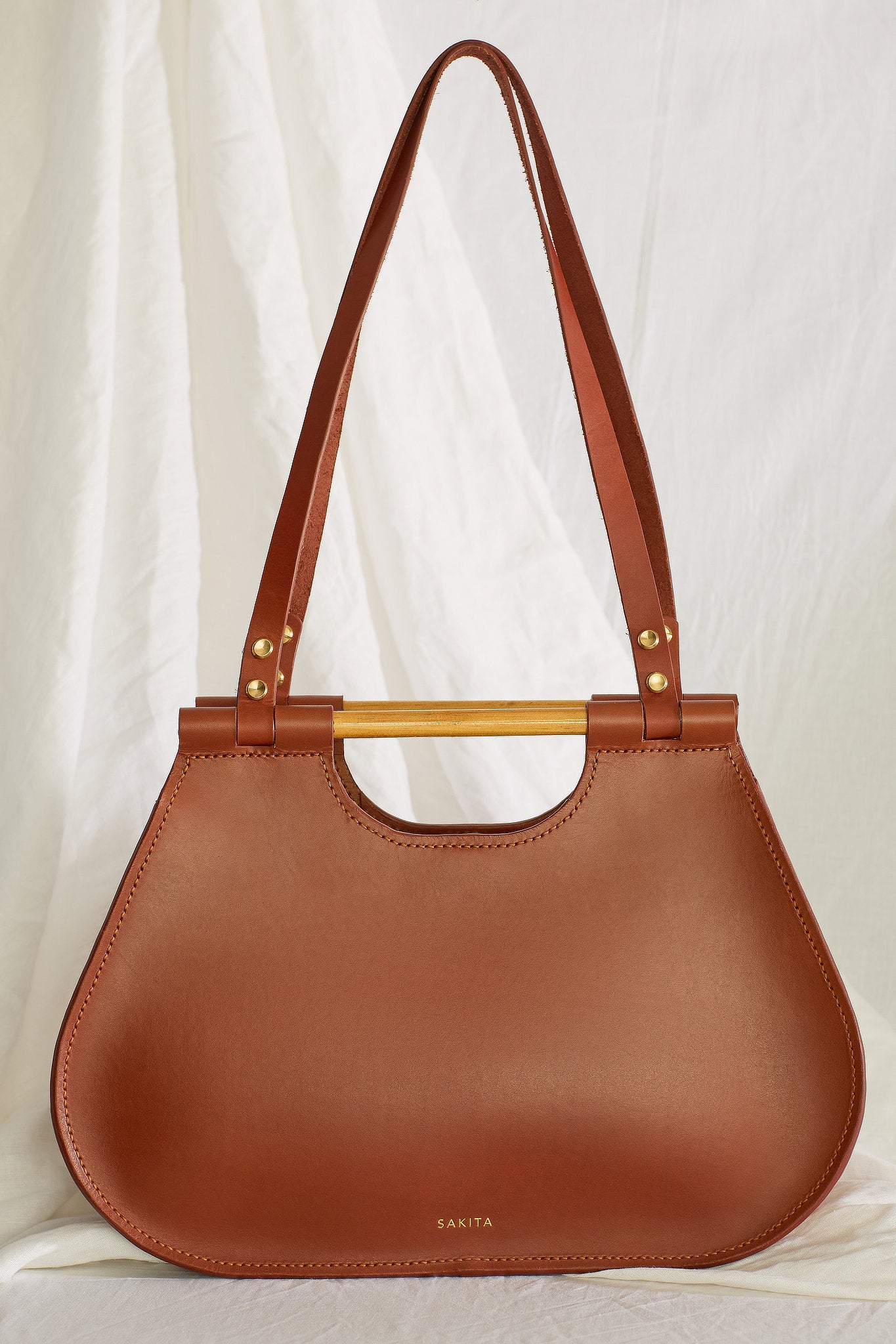 Front view of the Ophelia leather tote bag in maroon