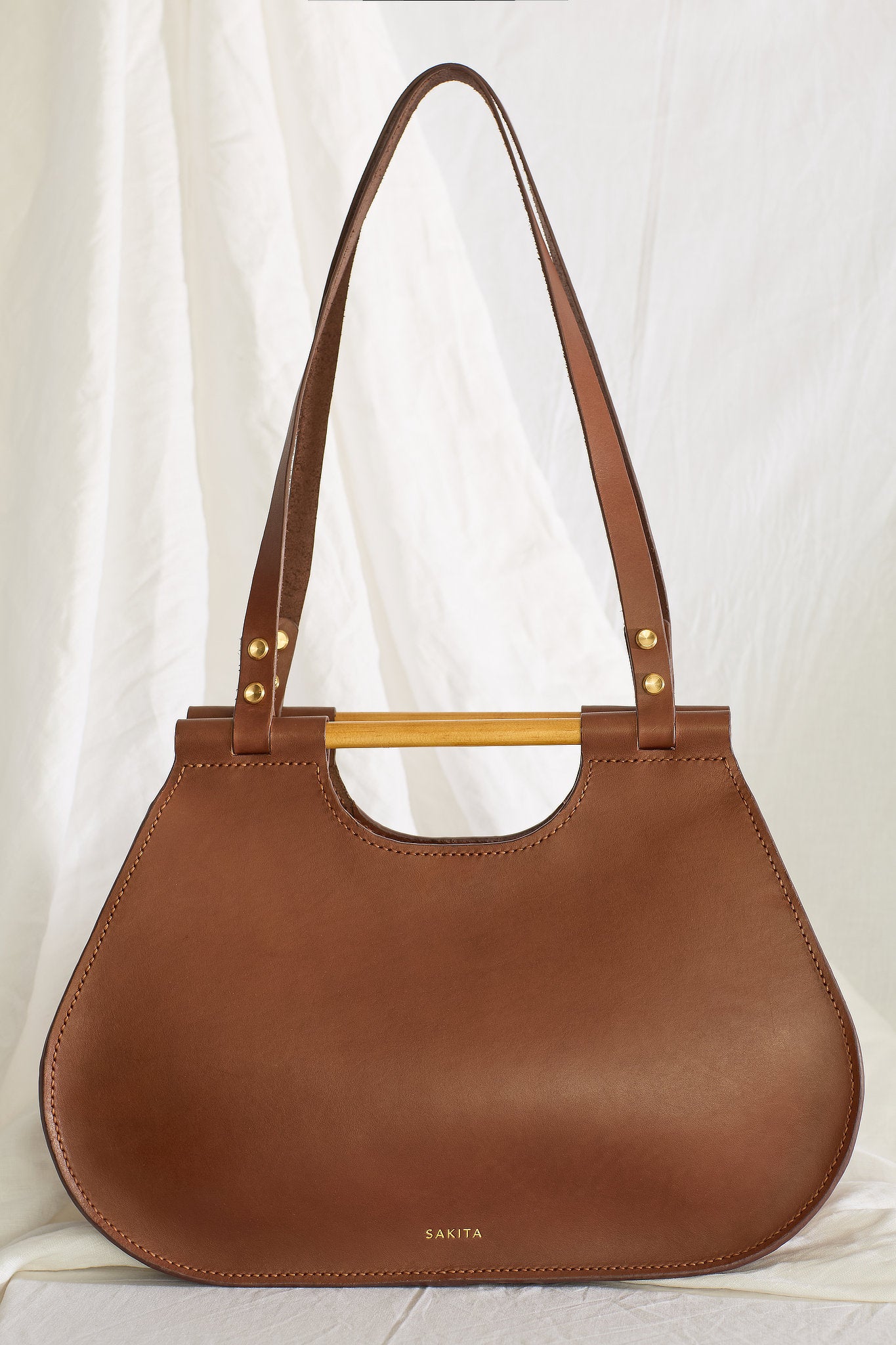 Front view of the Ophelia leather tote bag in brown