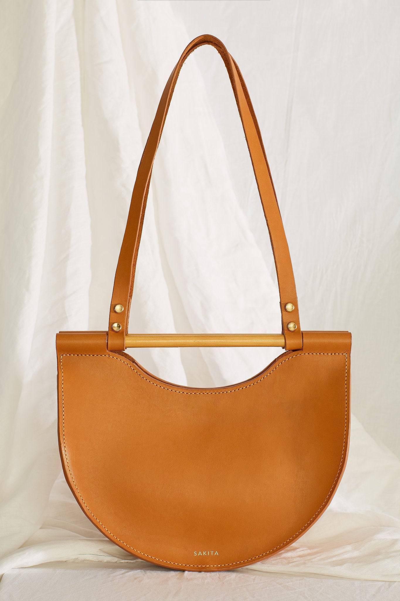 Front view of the Celine leather shoulder bag in tan