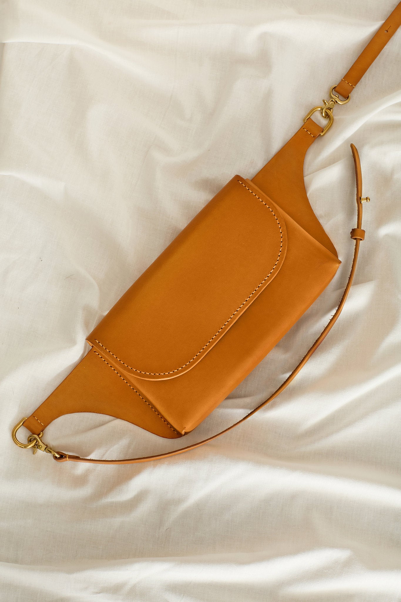 Aerial view of the Effie leather belt bag in tan