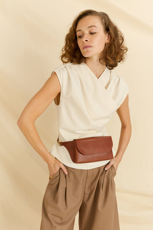 Model faced forward wearing the Effie leather belt bag around the waist